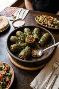 Tender zucchini stuffed with a savory blend of plant-based minced meat and earthy mushrooms, perfectly roasted for a rich, guilt-free flavor.كوسة غضة محشوة بمزيج شهي من اللحم النباتي المفروم والمشروم، محمرة بعناية لتقدم طعماً غنياً وخياراً صحياً مثالياً.